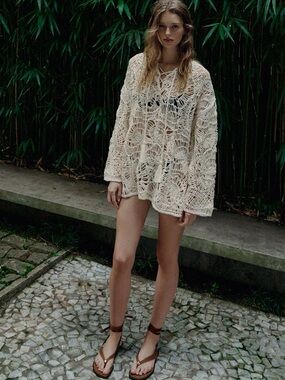 Zara Open-Knit Tassel Dress in Ecru features a distinct crochet pattern